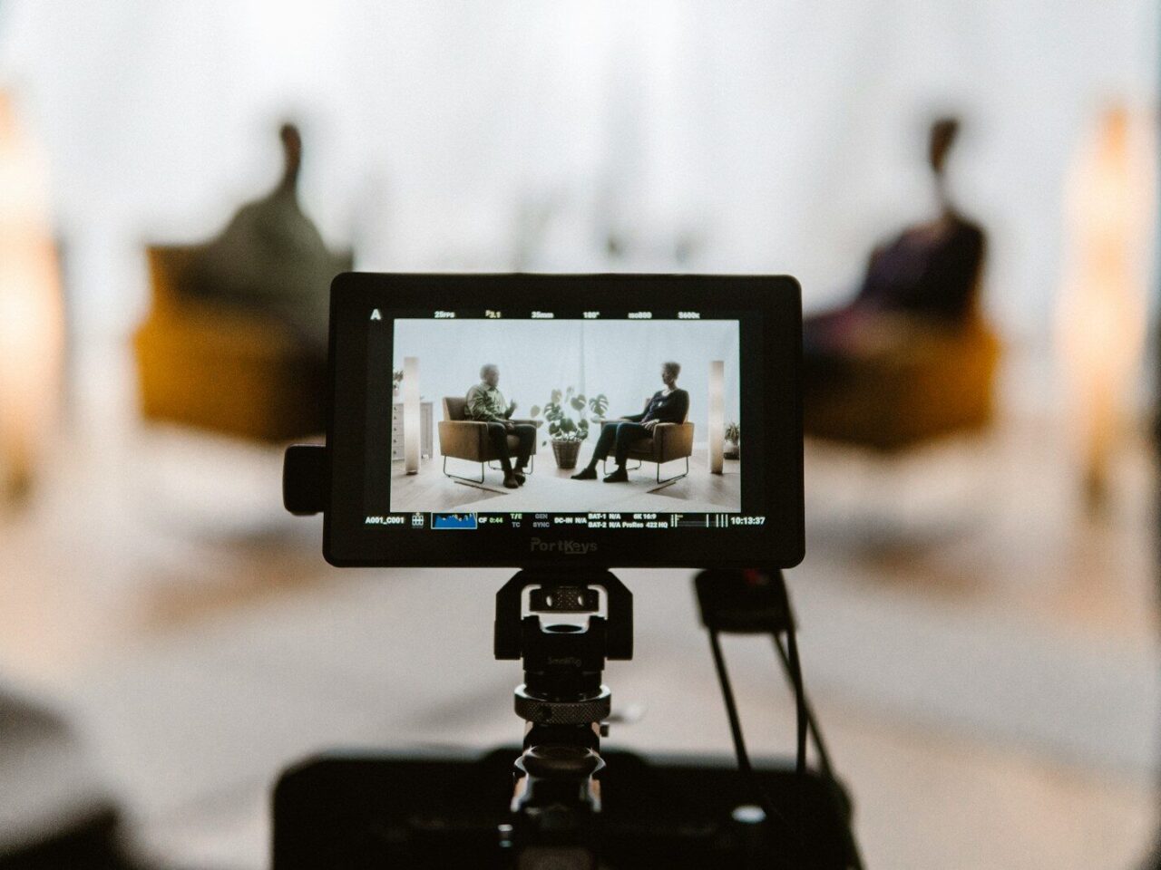 a tripod with a camera attached to it